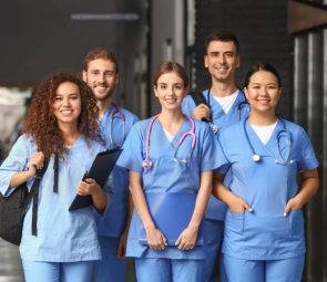 A group of health workers smiling together