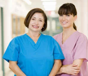 Two health workers smiling together