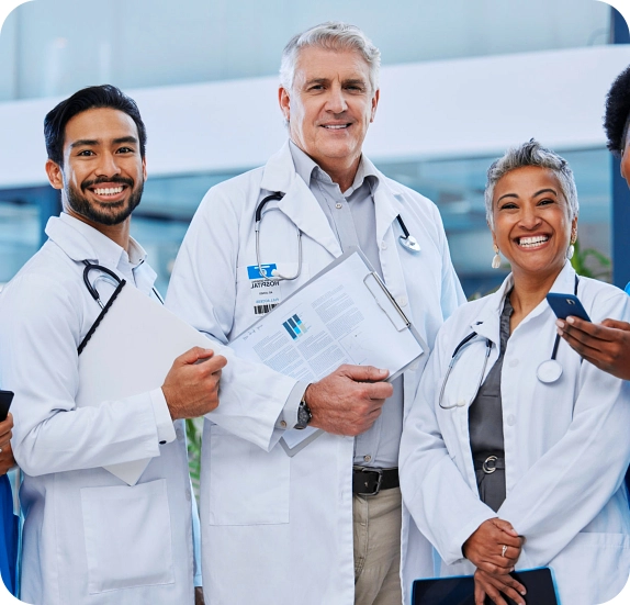 Three health staff smiling together