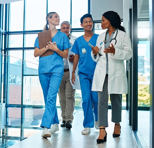 Four health workers talking to each other