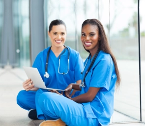 A female health staff smiling