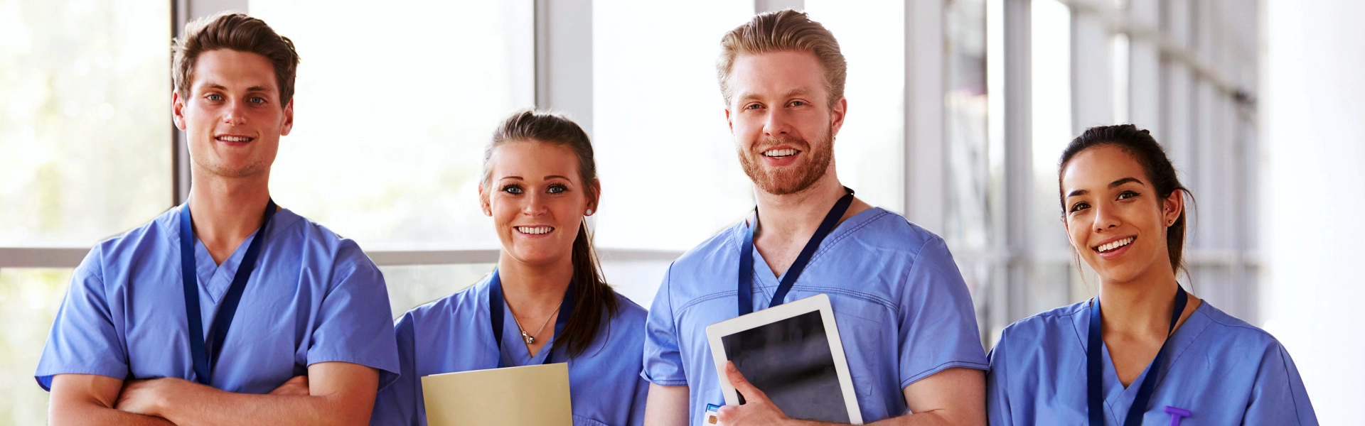 Four health staff smiling together