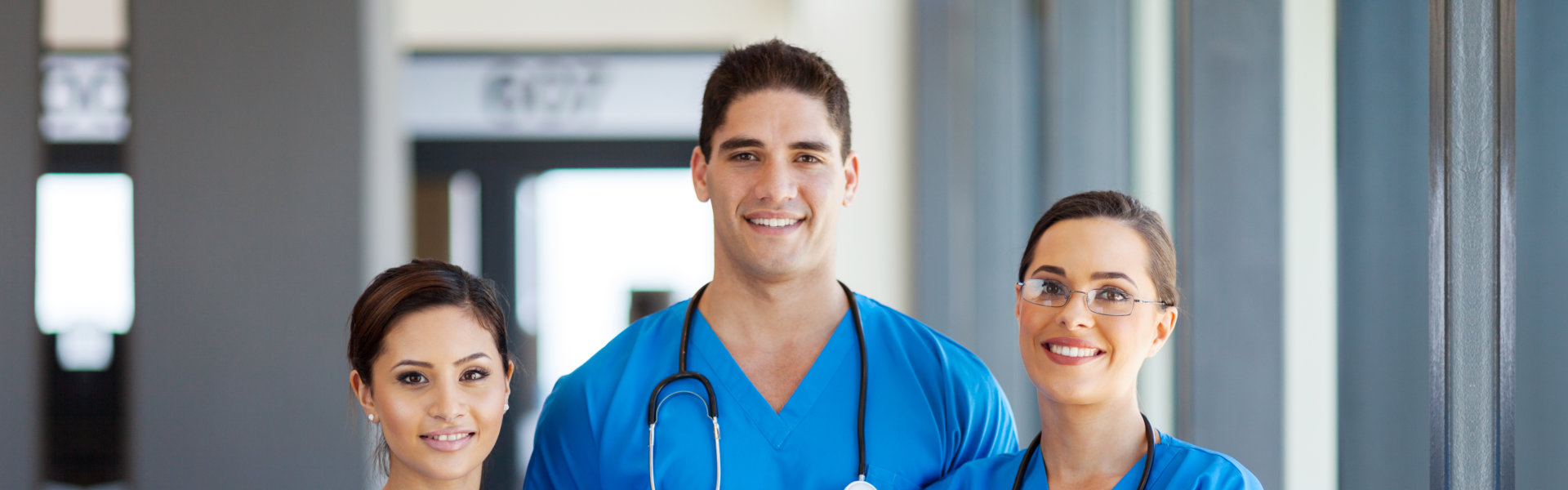 Three healthcare staffs smiling