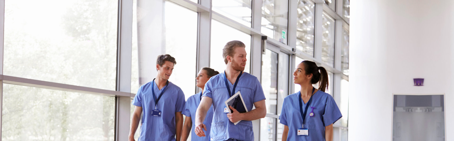 Four healthcare staffs walking