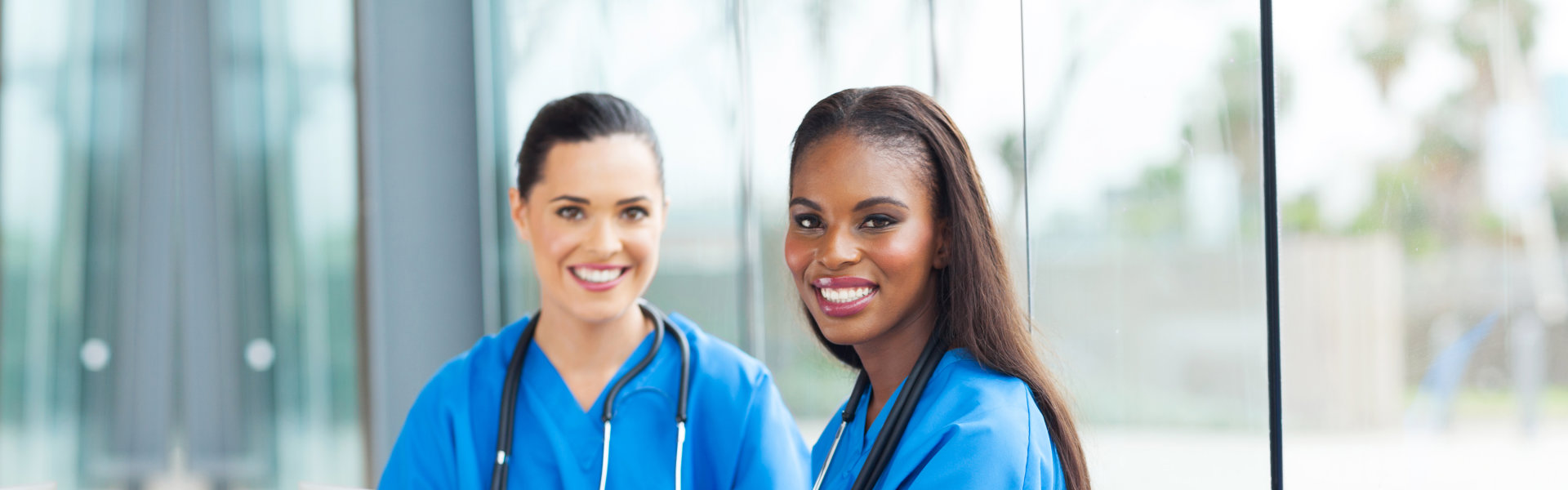 Two female nurse smiling