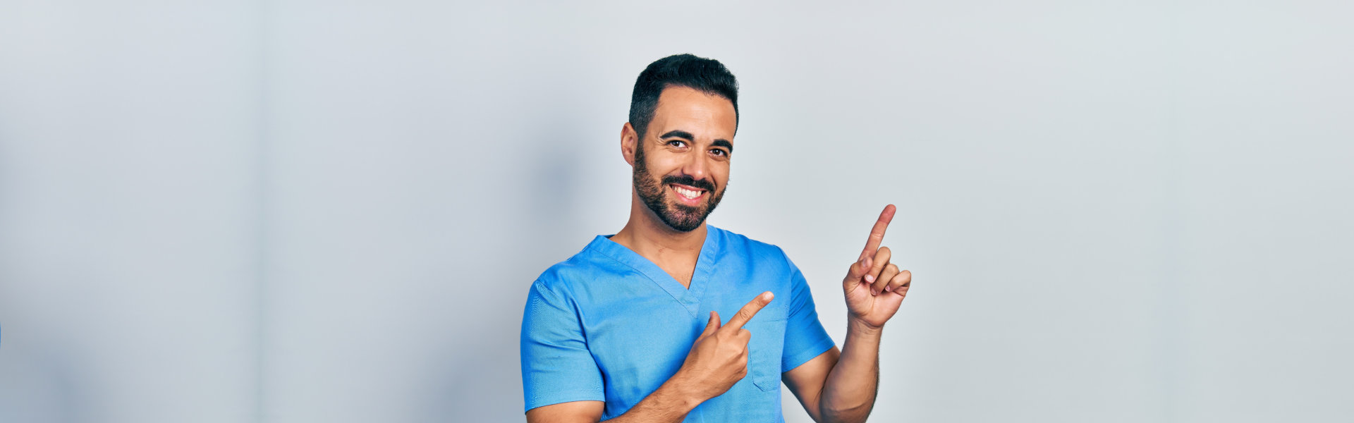 A male healthcare staff smiling